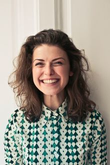 Illustrative stock portrait, not the reviewer